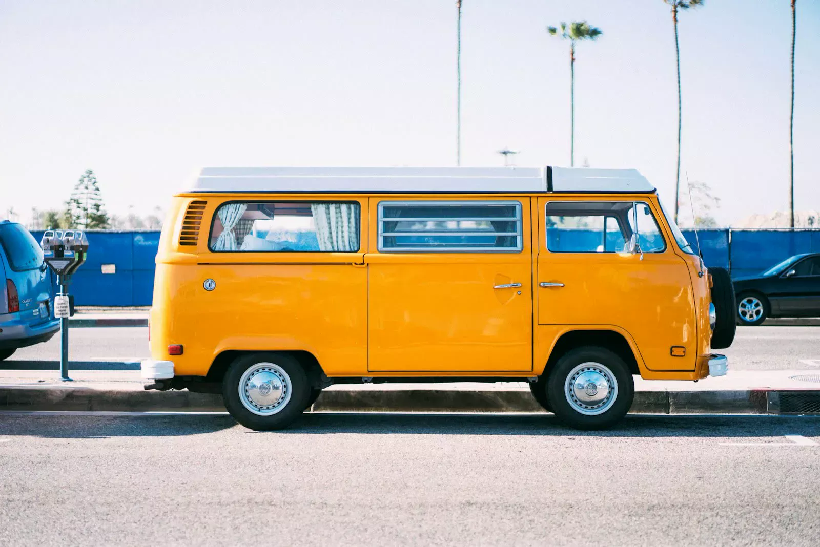 Yellow van parked roadside, shown with the oversize load travel restrictions article